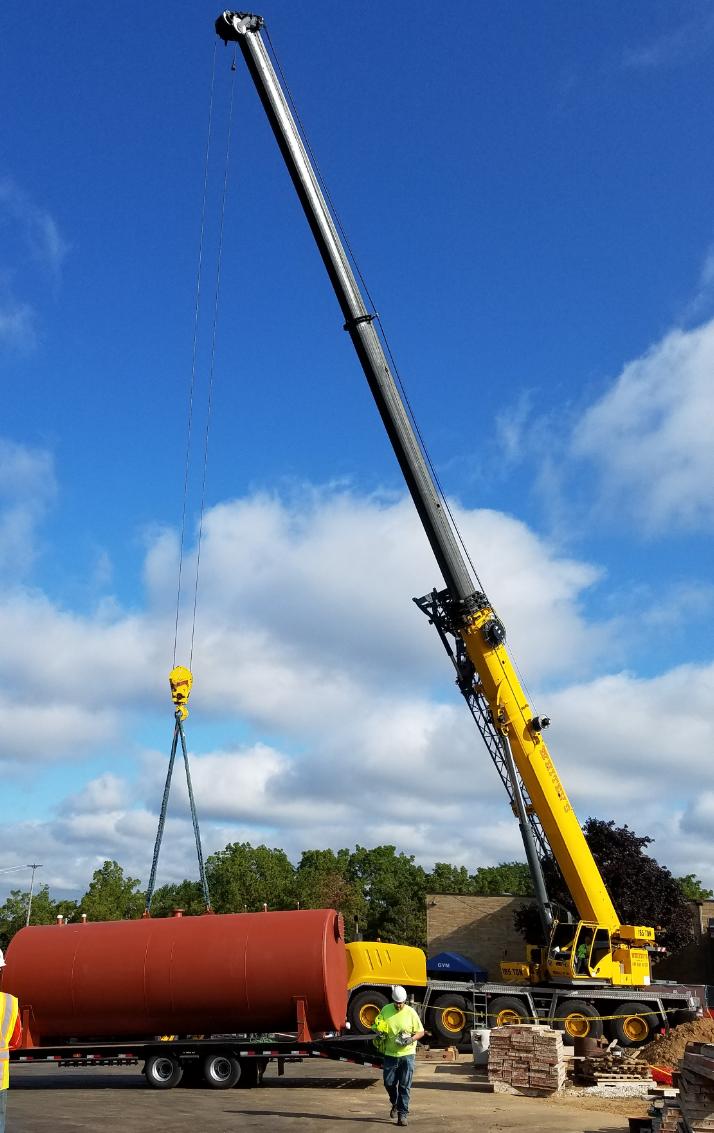 Crane lifting a huge tank 